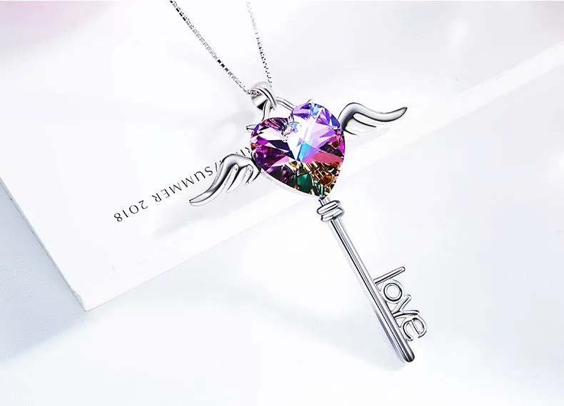 Sterling silver sapphire winged key necklace